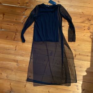 New with tags long tulle with cotton under shirt. Size M